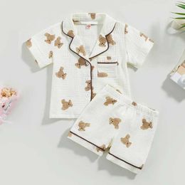 Pajamas حديثي الولادة Pajamas Pajamas Lounge Boys and Girls Cartoon Bear Print Short Sleeved Pocket Top+Shorts Usisex Stylel2405