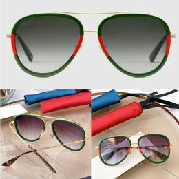 Designer metal sunglasses Gold metal with green red Web frame Green shaded lens 100% UVA/UVB protection Luxury sunglasses 0062