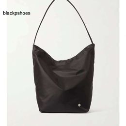 The Row TR capacity nylon bucket bag with large Tote bag is lightweight commuting one shoulder portable simple lazy and practical