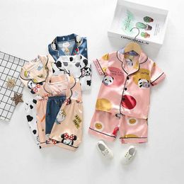 Pajamas Childrens Silk Satin Pajama Set Baby Boys and Girls Cartoon Flip Neck T-shirt Shorts 2PCS Set Childrens Summer Silk Night Light Lounge d240515