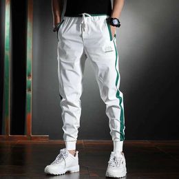 Pantaloni da uomo da uomo pantaloni a strisce bianche sottili estate casual slim matita pantaloni ricamo ricamo di seta di seta ghiacciata pantaloni y240513