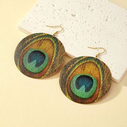 Charm Bohemian ethnic style peacock feather earrings for female internet celebrities with trendy design and geometric circle earrings