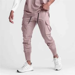 Pantaloni da uomo 2024 nuovi uomini pantaloni sportivi fitness sottili pantaloni da jogging da jogging elastico a secco rapido