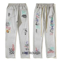 Rhude High end designer trousers for High Street Cartoon Comics Handdrawn Teenage Men and Women Same Style Couple Hoop Guard With 1:1 original labels