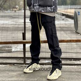 Rhude High End Designer 바지를위한 하이 스트리트 패션 멀티 포켓 기능적 바지 남성 1 : 1 오리지널 레이블이있는 패션 캐주얼 바지