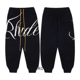 RHUDE High End Designer byxor för korrekt av trendiga bokstäver reflekterande avslappnade byxor för män och kvinnor high street byxor med 1: 1 originaletiketter