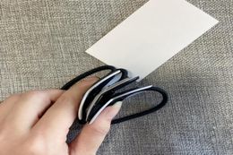 Fashion simple black white acrylic head rope rubber band hair ring hairpin popular headwear jewelrys in European and American co8700685