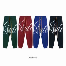 Pantaloni di design di fascia alta rhude per lettere floreali a maglia a maglia di moda pantaloni casual di alta strada per uomini e donne con etichette originali 1: 1