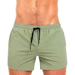 Men's Swimwear Mens Tight Short Swimwear Swim Trunks Quick Dry Solid Board Shorts Beach Pants Bathing Suits With Pockets and Mesh Lining Y240517