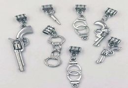 Necklace pendant 100PCS lot Pistolrevolver bullets Handcuffs Charms Pendant NecklaceBracelets Jewelry Accessories Fashion Gift 1713614