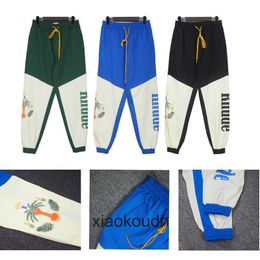 Rhude High -End -Designerhose für Herbst Casual Hosen Kontrastfarbe Overalls Mode Mens Kokosnussbaum -Leggings mit 1: 1 Originalbeetikeln