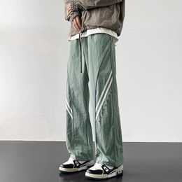 Pantaloni casuali in stile coreano harajuku pantaloni tecnologici leggeri joggers dritti rapidi pantaloni elastica in vita elastico 240517