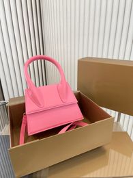 fashion designer shoulder bag cross body iconic handbag gold metal hardware reinforced handle black pink white crossbody