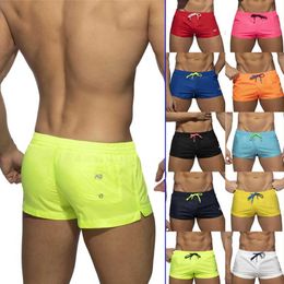 Men's Swimwear European and American New Swimming Pants Mens Solid Color Quick Drying Low Waist Sexy Beach Pants Mens Swimming Sports Shorts Y240517