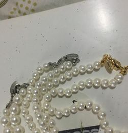 Fine Saturn Lady Pendant Necklace with Rhinestones Creative Planet Pearl Necklace Clothing Accessories Gifts for Friends g026023173