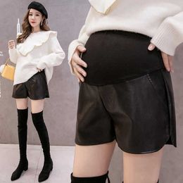 Maternity Bottoms Cotton belly decal PU leather shorts suitable for pregnant women fashionable wide leg shorts pregnant womens side split tight pants H240518