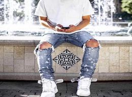 2020 New Trendy Mens Slim Fit Jeans White Paint Dot Ripped Midwaist Stretch Feet Hole Ripped Denim Long Pants X06219541355