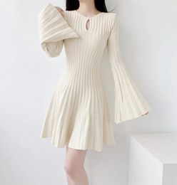 Casual Dresses 2024 Designer Fashion Sexy Hollow Out Knitted Sweater Dress Women O Neck Flare Sleeve Beige Slim Waist Pleated Short Vestido