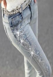diamond drilled hole pencil women jeans Ripped trousers with Rhine denim pants woman 2103128742569