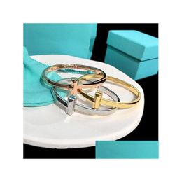 Bangle Titanium Steel Esigner Cross T Logo Charm Cuff For Women Jewellery With Box Party Gift Drop Delivery Bracelets Otqez