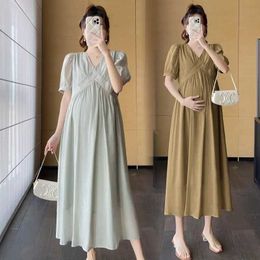 Maternity Dresses 2024 New arrival of fashionable pregnant woman Midi long dress elegantly crossing V-neck loose fitting daily clothing for pregnant women d240520