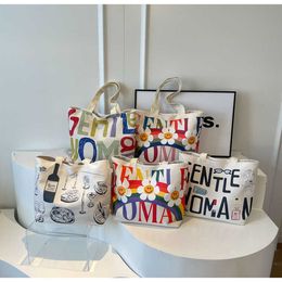 Trendy and niche canvas bags for women in 2024, large capacity tote bags, cartoon letters, single shoulder women's bags, minimalist 240520