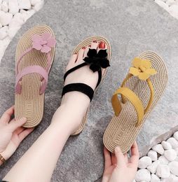 2020 Women Straw Weaving Flats Slippers Women039s Flower Flip Flops Female Flat Heel Korean Wave Outside Beach Shoes Toe Clampi3010104