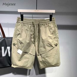 Men's Shorts Product shorts mens casual fashion day solid color Japanese style knee long pockets fully matched with summer street youth fashion Q240520