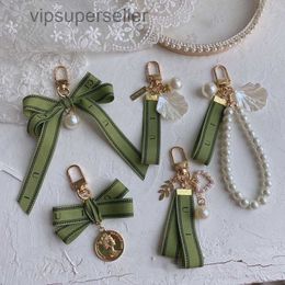 Designer keychain Luxury key chain bag charm female car key ring Pearl charm green ribbon delicate shells keychain couple pendant gift nice good