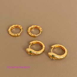 Luxury gold Carttrrie earrings European and American Green Eyes Snake shaped Buckle INS Personalized Bamboo Metal Earrings Versatile Earrings Female Copper Plate