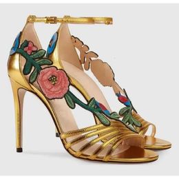 Design Top Brand Women Fashion Open Toe Flowers Decorated Stiletto Gold Black Ankle Strap High Heel 89d