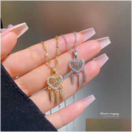 Pendant Necklaces Light Luxury Dreamcatcher Necklace For Women Titanium Steel Chain Feather Hollowed Heart Niche Design Chok Dhgarden Dhwk3