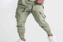 2022 Summer Thin Ice Silk Pants Men's Korean Version Brand Straight Sports Pants Fast Drying Breathable Multi Pocket Casual Pants Bodybuilding Trainer3857138