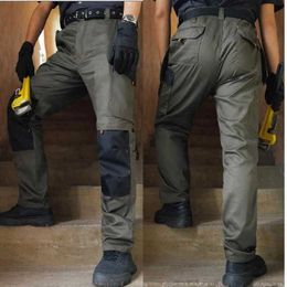 Pantaloni da uomo vestiti da lavoro elastico da lavoro da uomo veicoli da trasporto cargo resistenti ai pantaloni multiuso per esterni per esterni pantaloni di protezione del lavoro y240522