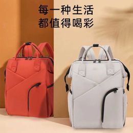 Diaper Bags New Simple Casual Oxford Cloth Moms Bag Waterproof Large Capacity Backpack with Pushable Cart to Carry Mom and Baby Bags d240522