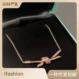 Designer's Brand New Twisted Knot Necklace for Womens Light Luxury and Minority Rose Gold Bow Chain High Grade Pink