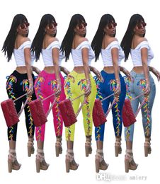 Europäische und amerikanische Hosen Mode Damenkorn Ribbon Nachtclub Windwäsche Jeans mehrfarbige Verbrennungsblumen Hosen972201010