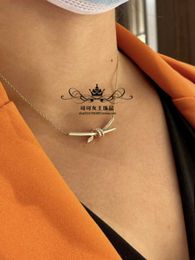 Designer's 925 sterling silver Brand Knot necklace for women with a light luxury and niche design interwoven diamond double knot pendant collarbone chain accessory
