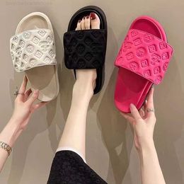 Thick soled slippers for women wearing Velcro sponge cake embossed bread shoes for summer outings fashionable one line beach sandals