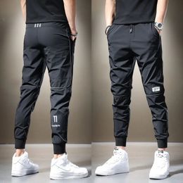 Summer Mens Casual Pants Black Grey Dragging Jogger Lightweight Breathable and Quick Drying Trousers Ice Silk Sweatshirt Mens 240521