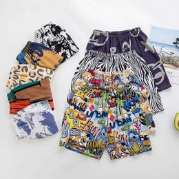 Shorts Boys swimming shorts fashionable beach shorts childrens board shorts 2 4 6 7 8 9 10 years teenagers swimming relay childrens quick drying shorts Y240524