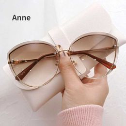 Sunglasses High quality womens oval rimless sunglasses Womens hot metal eye shadow Womens driving glasses Ms. Sonnenbrille zonnebrilL2405