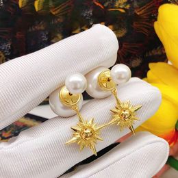 French classic vintage earrings with diamond-encrusted pearls and star studs