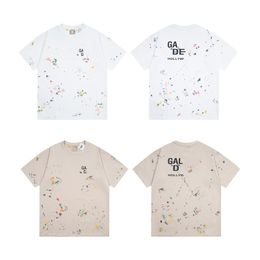 Men's short sleeves In 2024 fashion Graffiti and splash ink Pocket decoration loose and comfortable T-shirt leisure camouflage letter short-sleeved
