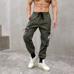 Pantaloni da uomo La persona che allunga i leggings di grandi dimensioni è sciolto casual e ha più tasche che superano la linea di ghiaccio trascinante maschile Q240525