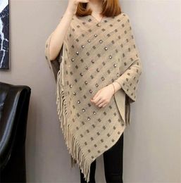 Autumn and winter knitted tassels in the long section of the shawl new loose cape coat female bat shirt3640424