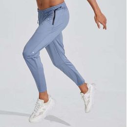 Lu l designer mens jogger długie spodnie sportowe strój jogi szybki suchy sznurka gimnastyczna kieszenie dresowe spodnie spodni swobodny elastyczna talia 9985ess