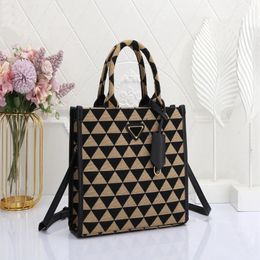 Classic triangle-shaped Tote bag with a single shoulder strap strap and detachable leather key chain 317J