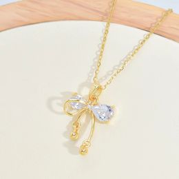 golden Bow knot butterfly pendant necklace versatile for women high-end feel, bell accessories niche design cross chain lock bone chain new style