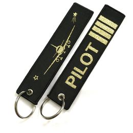 Tornari pilota all'ingrosso Porte Flight Crew Pilot Gift Clef Clef Aviation Key Chain Shinning Gold Color Woven Keyring Tags 10 Pcs Lot 2271